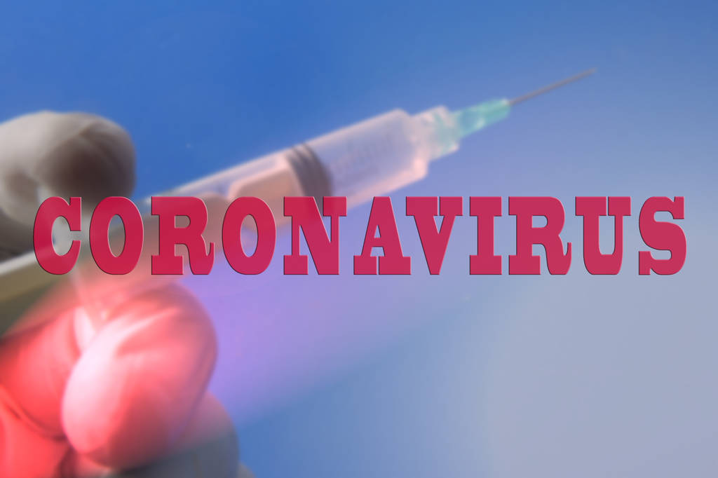 Medical concept with syringe for vaccination and CORONAVIRUS ins